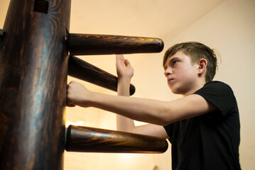 teenager boy training with Winchun wooden dummy, 10 year old child training wushu, Yunchunquan...