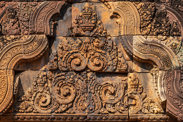 Bas-relief of Banteay Srei, the temple known for its beautiful carvings on red sandstone in Siem Reap, Cambodia. - 749499249