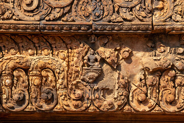 Bas-relief of Banteay Srei, the temple known for its beautiful carvings on red sandstone in Siem Reap, Cambodia. - 749499268