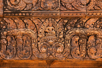 Bas-relief of Banteay Srei, the temple known for its beautiful carvings on red sandstone in Siem Reap, Cambodia. - 749499295