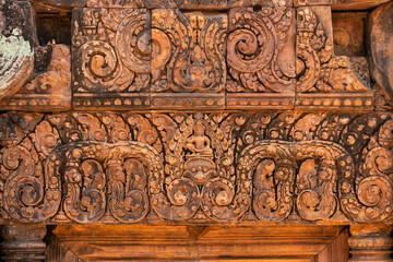Bas-relief of Banteay Srei, the temple known for its beautiful carvings on red sandstone in Siem Reap, Cambodia. - 749499297