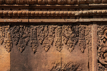 Bas-relief of Banteay Srei, the temple known for its beautiful carvings on red sandstone in Siem Reap, Cambodia. - 749499461