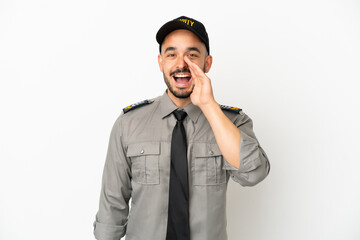 Young security  caucasian man isolated on white background shouting with mouth wide open