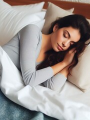 a woman sleeping in bed