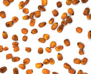 Fried salty corn grains isolated on white background 