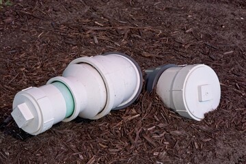 PVC drainage pipes protruding out of ground