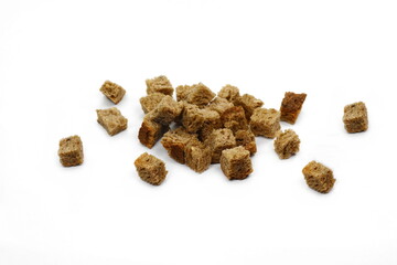 Tiny bread cubes isolated on white background. 