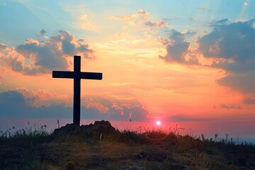 Cross on a hill representing holy week and spiritual reflection Set against a sunset backdrop - obrazy, fototapety, plakaty