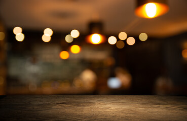 empty table to showcase your product, against the background of a blurred cafe golden bokeh. High...