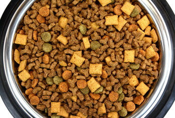 Dry Pet Food in a bowl isolated on white background. Dog or cat food isolated.