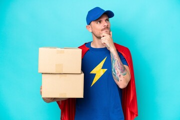 Super Hero delivery man over isolated background having doubts