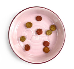 dry dog or cat food in a bowl isolated on white.