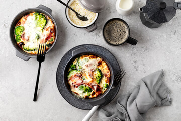 Broccoli, bacon Cheese Bake on a gray stone background