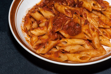 Pasta in red sauce on a table