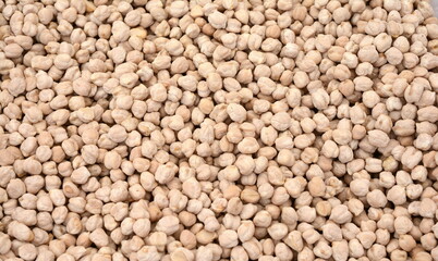 Dry organic chickpeas as a background.