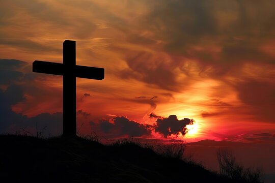 Silhouette of a cross against a dramatic sunset Symbolizing faith and spiritual reflection
