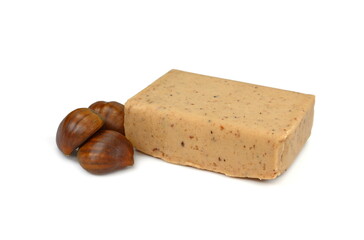 Chestnut puree isolated on white background. Chestnut puree, butter, brick. Chestnut puree bar.