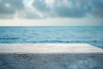 The empty concrete table top with a blurred background of ocean