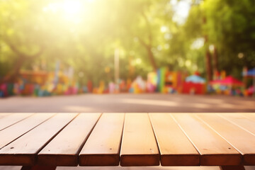 The empty wooden table top with a blurred background of a summer park