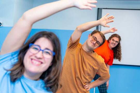 Man with down syndrome and friends enjoying gym class