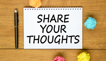 Fototapeta premium Share your thoughts symbol. Concept words Share your thoughts on beautiful white note. Beautiful wooden background. Black pen. Colored paper. Business share your thoughts concept. Copy space.