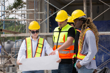 Group of male and female engineer construction working together at construction site. Foreman construction working at construction site