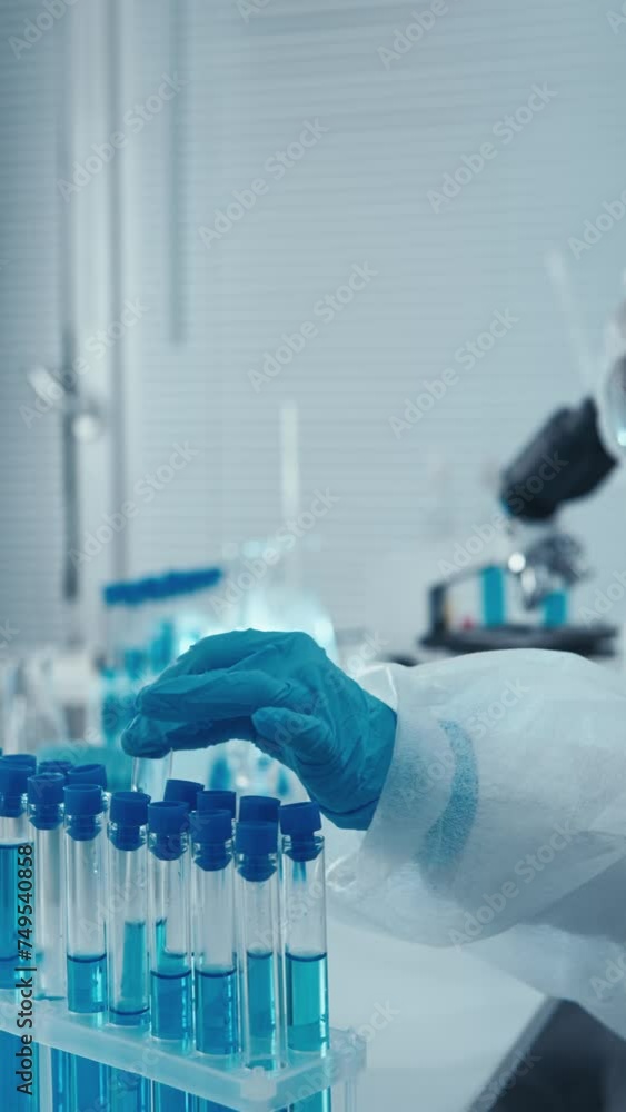 Poster a medical researcher analyzes genetic screening data to identify the risk of developing hereditary d