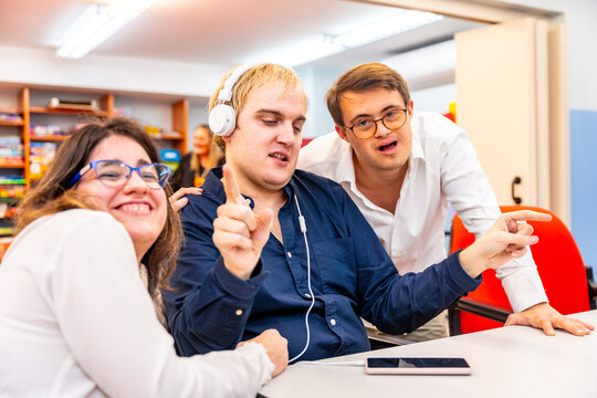 Disabled people having fun listening to music together