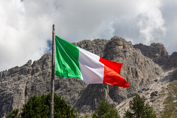 Italy flag on wind mountain background