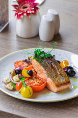 grilled fish salmon with vegetables, color food, healthy, tomatoe, olive, fresh food, serving , restaurant