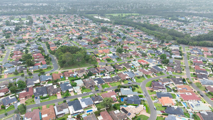 Obraz premium Drone aerial photograph of residential houses and surroundings in the greater Sydney suburb of Glenmore Park in New South Wales in Australia