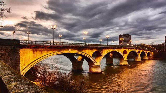 Timelapse Bridge of Catalans (Amidonniers Bridge) is Toulouse, France bridge crossing Garonne river. It is bridge in arch and stone and reinforced concrete inaugurated in 1908. Architect Paul Sejourne