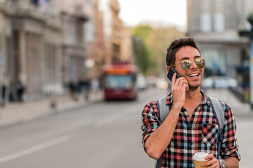 Hipster talking on mobile phone. Planning my weekend