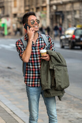 Hipster talking on mobile phone. Planning my weekend