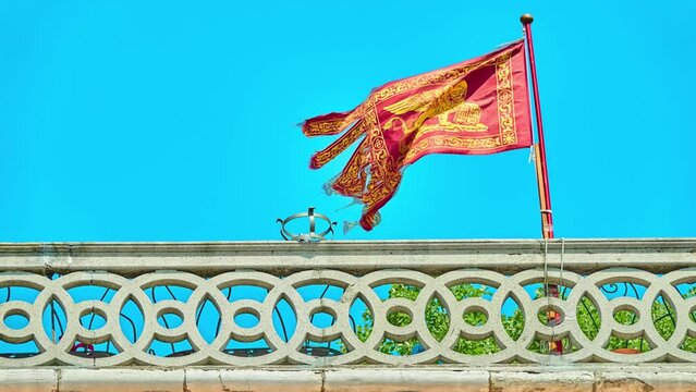 VENICE, ITALY - APRIL 26 2018: Flag of Republic of Venice, Banner or Standard of Saint Mark, was the symbol of Republic of Venice, until its dissolution in 1797. Pedrocchi Street, Venice, Italy.