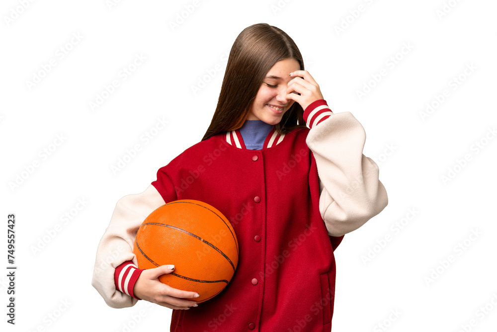 Sticker Teenager girl playing basketball over isolated chroma key background laughing