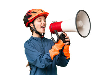 Teenager cyclist girl over isolated chroma key background shouting through a megaphone - obrazy, fototapety, plakaty