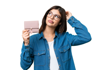 Young Russian woman holding a wallet over isolated chroma key background having doubts and with confuse face expression