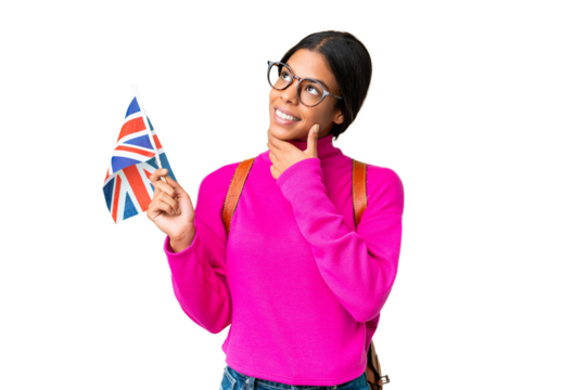 Young African American woman holding an United Kingdom flag over isolated chroma key background thinking an idea while looking up