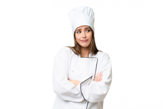 Young chef caucasian woman over isolated background making doubts gesture while lifting the shoulders
