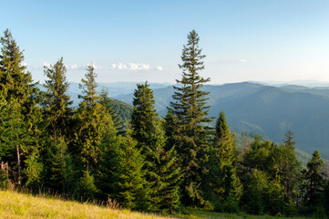 beautiful mountain valleys and mountains on a bright sunny day on the background of a wide valley