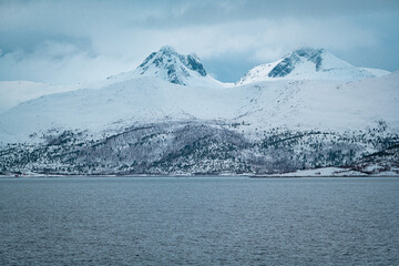Detailed image of snow-capped mountains along a norwegian fjord on the Lofoten, northern Norway