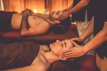 Keuken spatwand met foto Couple customer enjoying relaxing anti-stress head massage and pampering facial beauty skin recreation leisure in warm candle lighting ambient salon spa in luxury resort or hotel. Quiescent © Summit Art Creations
