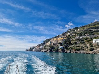 Fototapeta na wymiar The Magnificent Amalfi Coast in Italy is a breathtaking stretch of coastline renowned for its dramatic cliffs, charming villages, and crystal-clear waters.