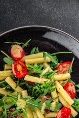 pasta salad tomato, arugula, boiled pasta fresh food tasty healthy eating cooking appetizer meal food snack on the table copy space food