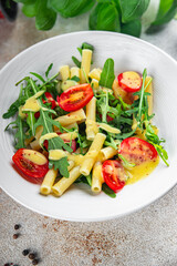 pasta salad tomato, arugula, boiled pasta fresh food tasty healthy eating cooking appetizer meal food snack on the table copy space food