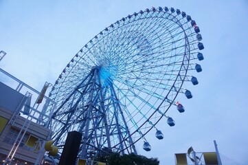 The Tempozan Ferris Wheel in Osaka Bay, Japan, offers stunning views of the city and harbor from...