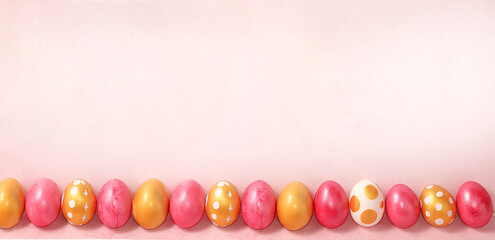 Obraz premium Happy Easter concept, spring card, background or banner for screen, template for design with place for text. Decorated pink Easter eggs on delicate background,