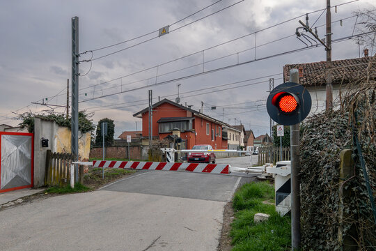 Sommariva del Bosco, Italy: Level crossing closed with red light on SFM4 Alba - Turin - Caselle Airport railway line