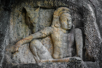 Fototapeta na wymiar Man and the Horse Head stone carving in Isurumuniya, Anuradhapura, Sri Lanka.